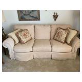 Broyhill Upholstered Sofa with Skirt and Accent Pillows