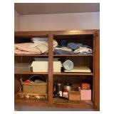 Wooden Cabinet with Mixed Household Goods, Storage Bins, Linens, and Containers