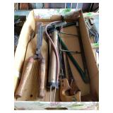 Assorted Hand Tools Including Saws, Long-Handle Shears, and Pump Mechanism in Box