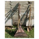 Assorted Yard and Garden Hand Tools Including Rakes and Shovels