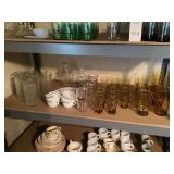 Large Assortment of Glassware and Dinnerware on Shelves