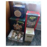 Assorted Holiday Decor Lot Featuring Avon Crystal Tree, Animated Figure, Carousel, Mugs, and Starlight Sphere