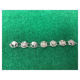 Coin Cut-Out Link Bracelet Featuring Pierced Coins