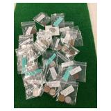 Assorted World Coins in Individual Labeled Bags Lot