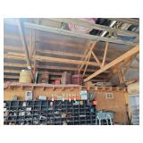 Loft Storage Assortment with Tractor Parts, Furniture, and Containers