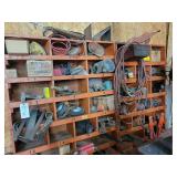 Shop Storage Shelving Unit with Contents including Tractor Parts, Hoses, and Hardware