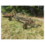 Green Farm Cultivator Implement with Tines and Gauge Wheels
