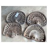 Group of Four Assorted Cast Iron Implement Seats