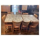 Two Restaurant Tables with Faux Stone Laminate Tops and Eight Wood Dining Chairs