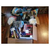 Assorted Household Box Lot Including Kitchenware, Board Games, and Handbag