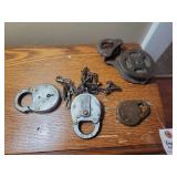 Assorted Collection of Metal Padlocks, Chains, and Pulley Block