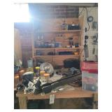Custom Wooden Workbench with Integrated Shelving and Assorted Workshop Tools