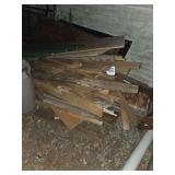 bunch of lumber beside garage and above garage