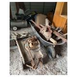 Farm Implement Lot with Wood Wagon, Wheelbarrow, Cast Iron Seat, and Pulleys