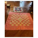 Two Textile Quilt Tops Featuring Geometric and Checkerboard Patterns