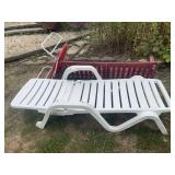 Lot of Three Outdoor Furniture Pieces Including White Plastic Lounger, Red Sling Lawn Chair, and Wooden Porch Swing