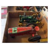 Lot of Two Toy Tractors Including Tru-Scale Red Tractor and Green Cast Iron Tractor