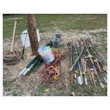 Lot of Farm and Fencing Equipment Including T-Posts, Wire, and Hand Tools