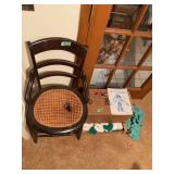 Wooden Armchair with Cane Seat and Antique play doll in original cases with cloths and book
