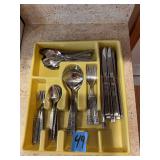 Stainless Steel Flatware Set with Ornate Handles in Yellow Tray