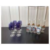 Assorted Glassware Lot Including Purple Wine Glasses, Hard Rock Cafe Hurricane Glasses, and Nolan Ryan Baseball Tumblers