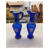 Pair of Cobalt Blue Glass Pitchers with Gold Gilt Floral Motifs