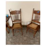 Set of Two Carved Wood Chairs with Cane Seats