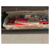 Plastic Storage Bin with Gift Wrapping Supplies and Ribbons