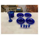 Cobalt Blue Glass Tabletop Collection including Plates, Candlestick, Bucket, and Small Tumblers
