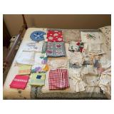 Assorted Textile Lot Including Doilies, Linens, Tablecloths, and Gloves