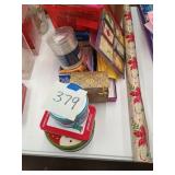 Gift wrapping items, lights, tins