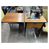 Antique sewing machine and cabinet