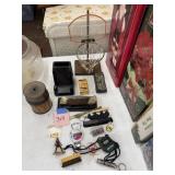 Pocket knives, trident, coin holder, etc