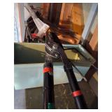 Shelf of yard tools, bike bump, shepherd hooks +