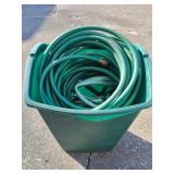 Garbage can with hoses