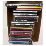 Box of rock CDs and Neil Diamond dvd