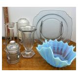 assorted glass items, including candleholders