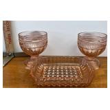 pink glass glasses and dish
