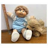Cabbage patch doll and stuffed dog