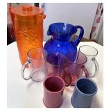 assorted plastic cups and pitcher