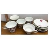 assorted tea cup, cups and plates