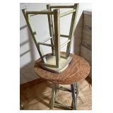 Two barstools with round plywood attached to top
