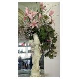 statue with floral arrangement