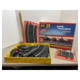 SCX slot car tracks and controllers