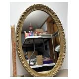 oval, gold frame mirror