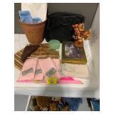 BASKET OF PLUSH UNDER TABLE, BASKET TRASHCAN,