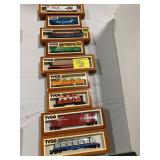 ROW OF TYCO BOXED TRAIN CARS