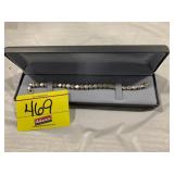 .925 MARKED TENNIS BRACELET W/ CLEAR STONES