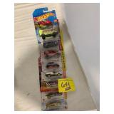 ROW OF HOT WHEELS CARS ON CARDS