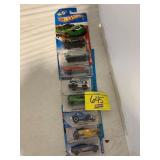 ROW OF HOT WHEELS CARS ON CARDS